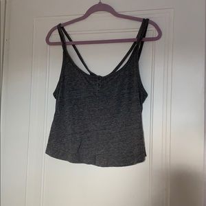 Grey tank with crossed straps